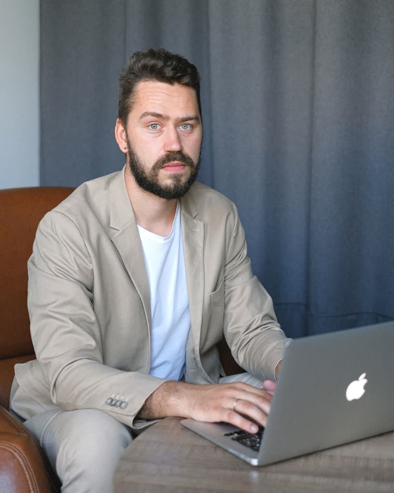 Founder working on a laptop in an office
